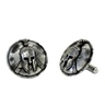 Authentic Spartan Helmet 925 sterling silver cufflinks - angled pair view on a cracked shield backdrop, showcasing the warrior aesthetic.