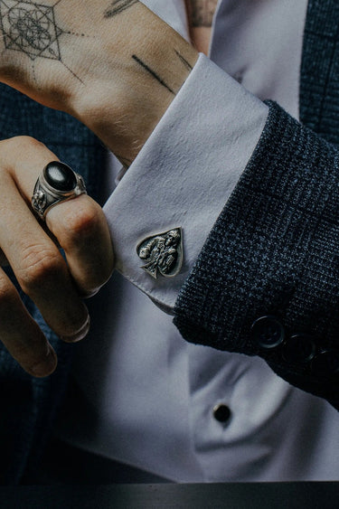 Death Ace 925 sterling silver cufflinks - angled pair view of the gambler skeleton design within the Ace of Spades shape.