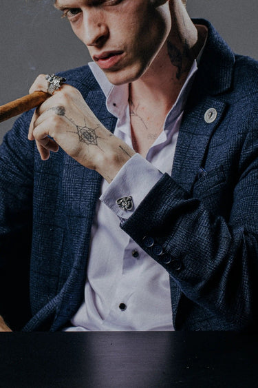 Dynamic shot of the Death Ace 925 silver cufflinks pair, emphasizing the intricate details on the "Dead Man's Hand" cards.