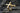 Gold vermeil horizontal cross ring showing detailed craftsmanship and sharp edges on dark stone surface