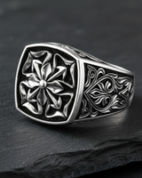 Side profile of a handcrafted 925 sterling silver Maltese Cross ring displaying the ornate filigree detail on the shank.