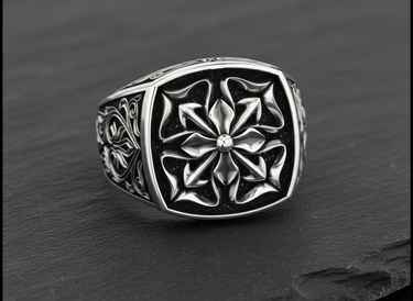 Front view of the handcrafted silver Maltese Cross ring highlighting the oxidized finish and intricate floral design on its face.
