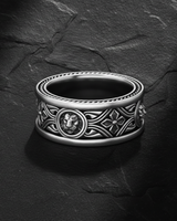 925 sterling silver lion ring with Celtic knotwork and quatrefoil patterns on dark slate background