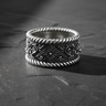 925 sterling silver rope floral ring with ornate square centerpiece and twisted rope edges on textured stone surface