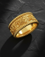 Golden finished rope floral ring displaying ornate centerpiece with decorative flower motifs and rope textured band