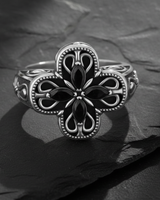925 sterling silver cross ring with black marquise gemstones in quatrefoil design on dark slate background