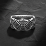925 sterling silver geometric ring with diamond and square patterns displayed on textured slate background