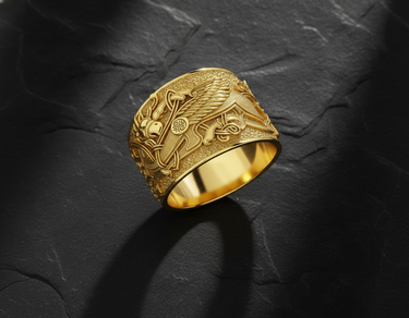 Gold finish griffin ring showing intricate feather details and geometric patterns on textured stone surface