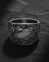 925 sterling silver griffin ring with Celtic knotwork and detailed wings displayed on dark slate background