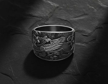 925 sterling silver griffin ring with Celtic knotwork and detailed wings displayed on dark slate background