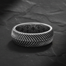 925 sterling silver herringbone ring with chevron pattern displayed on textured black slate surface
