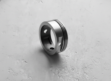 Top-down view of the men's Silver Piston Ring, detailing the mechanical design and smooth interior for comfortable wear.