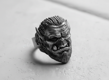 Profile shot of the handcrafted Silver Orc Ring, emphasizing the pointed ears, tusks, and oxidized silver finish.