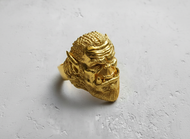 Detailed three-quarter view of the Silver Orc Ring, highlighting the intricate braided hair and formidable facial expression.