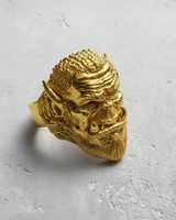 A brightly polished gold version of the Orc Warrior Ring, shown at an angle to showcase the same intricate fantasy details.