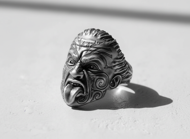 Side view of the Silver Maori Warrior Ring showcasing the oxidized finish on the intricate Tā moko style patterns.