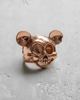 Rose gold vermeil cartoon mouse skull ring with a high-polish finish, capturing the light on its round ears and skull.