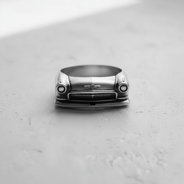 Front view of the handcrafted vintage automobile ring, with a clear focus on the bumper and hood ornament details.