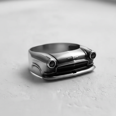 Side angle of vintage automobile ring showing hood ornament and bumper design in polished sterling silver