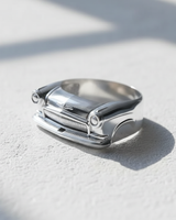 Front view of 925 sterling silver classic car ring featuring detailed grille and headlights on white surface