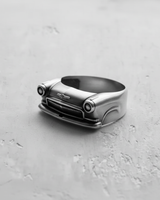 Front view of the handcrafted silver classic car ring, highlighting the intricate metalwork of the automobile grille.