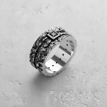 Oxidized sterling silver textured gemstone ring with a black square gem, showcasing the detailed craftsmanship and polished inner band.