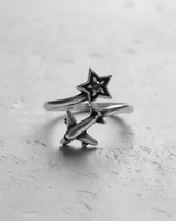 Angled close-up of the handcrafted 925 silver airplane star ring, detailing the polished airplane motif and celestial star design.