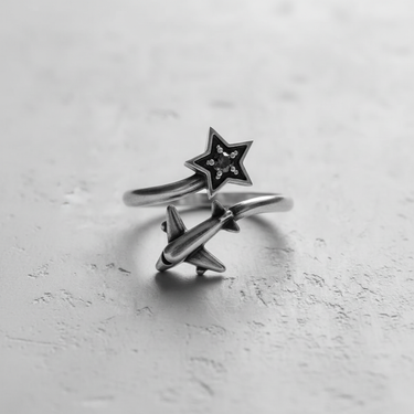 Angled view of the 925 sterling silver airplane star ring, highlighting the detailed airplane and star motifs.