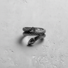 Side view of silver snake ring showing intricate scale details and wrapping tail structure