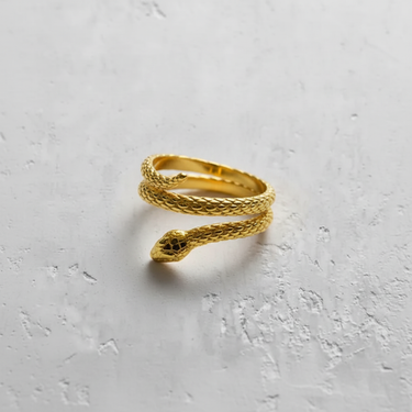 Gold-plated version of the coiled snake ring, highlighting the detailed serpent head with black accent eyes.