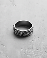 Handcrafted 925 sterling silver textured ring showcasing its irregular, brutalist-inspired abstract forms and wide band.