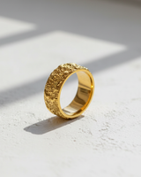 14k gold vermeil Silver Textured Organic Ring with a molten, crater-like surface, shown on a white textured background.