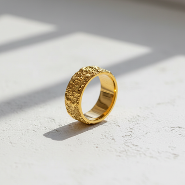 14k gold vermeil Silver Textured Organic Ring with a molten, crater-like surface, shown on a white textured background.