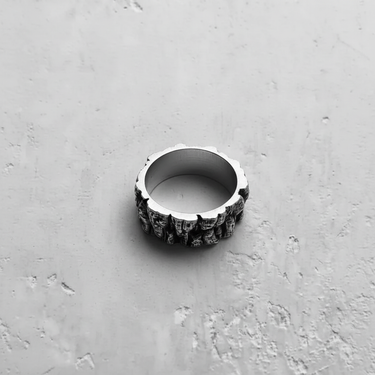 Top-down view of the Silver Rock Texture Ring highlighting the contrast between its smooth polished interior and rugged uneven exterior.
