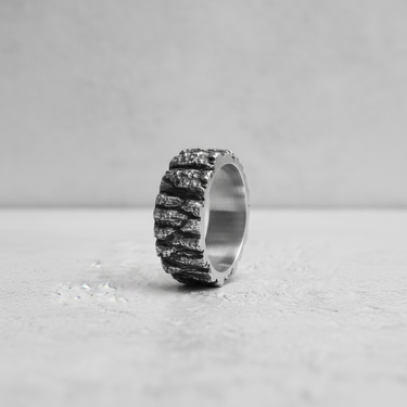 Side profile of the Silver Rock Texture Ring, detailing the depth of the rock-like crevices and the sturdy band width for men.