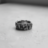 Front view of the Silver Rock Texture Ring, showcasing its craggy, mountain-like surface and oxidized finish on a neutral backdrop.