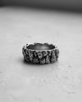Side profile of the Silver Mountain Ring, highlighting the deep, rock-like vertical texture and polished finish of the silver band.