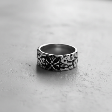 Black and white photo of the 925 sterling silver cross ring, focusing on the detailed stylized cross and rugged, textured band.