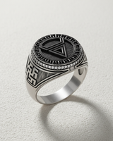 Angled view of the handcrafted geometric silver ring, showing the intricate side carvings and the sturdy sterling silver band.