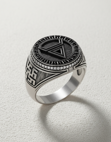 Angled close-up of the sterling silver geometric symbol ring, showing the detailed sunburst texture and sparkling pavé stones.