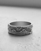 Front view of the wide-band Silver Wave Grid Ring, showcasing the intricate balance of flowing waves and the square grid pattern.