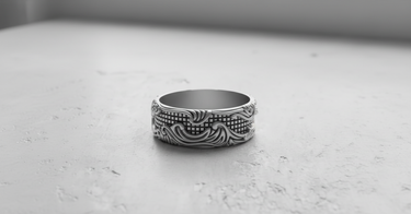 Front view of the wide band Silver Wave Grid Ring in a matte sterling silver finish, highlighting its craftsmanship.