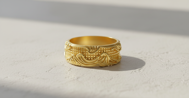 14K gold vermeil Silver Wave Grid Ring with ornate flowing patterns over a geometric background, shown in bright sunlight.