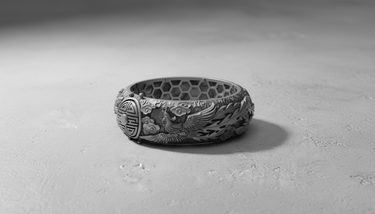 Front view of the Dragon Phoenix Ring in silver, showcasing the detailed phoenix carving, auspicious clouds, and 'Fortune' symbol.