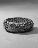 Oxidized sterling silver Dragon Phoenix Ring showing the detailed phoenix carving, auspicious clouds, and a good fortune symbol.