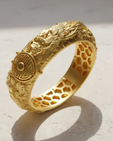 14K gold vermeil Dragon Phoenix Ring with intricate dragon carving and prosperity symbol on a textured white surface.