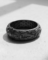 Side profile of the sterling silver Dragon Phoenix Ring featuring the intricately carved Eastern dragon amidst flowing cloud details.