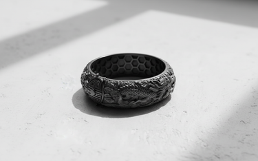 Side profile of the sterling silver Dragon Phoenix Ring featuring the intricately carved Eastern dragon amidst flowing cloud details.