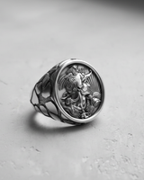 Front view of the handcrafted Silver Rooster Cameo Ring, detailing the sunburst background and the unique patterned band.