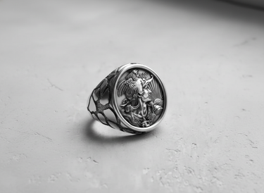 Front view of the handcrafted Silver Rooster Cameo Ring, detailing the sunburst background and the unique patterned band.